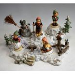 A Hummel Goebel Christmas advertising window display stand and figures, including Snowman, Skier,