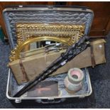 A canvas gun case; an Antler suitcase; decorative mirrors; tribal staffs;