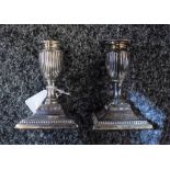 A pair of Victorian silver candlesticks, Sheffield 1888, inscribed to base,