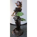 A bronzed metal floor standing model, of a pixie,