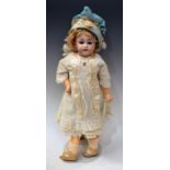 A Simon and Halbig bisque head doll, German 1850, with fixed blue eyes, feathered brows,