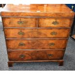 An early 20th century walnut chest,