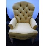 A contemporary button back scroll arm reading chair,