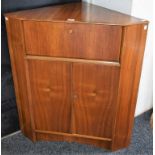 A retro mid-20th century Nathan corner bureau, fall front enclosing pigeon holes,