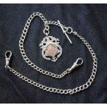 A fine link silver double Albert chain, graduated links, T-bar and shield adornments,