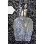 An early 20th century silver mounted scent bottle,