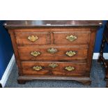 A George II oak chest, oversailing chamfered rectangular top above two short and two long drawers,