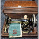 A Singer handcranked sewing machine,