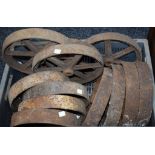 A collection of twelve assorted cast iron wheels