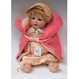 An Armand Marseille 995 A2 1/2 M baby doll, sleeping blue eyes, open mouth, two upper teeth,