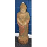 A large floor standing painted wooden figure, deity,