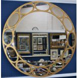 A contemporary circular wall mirror,