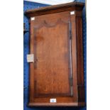 A George III style mahogany crossbanded oak corner cupboard, of small proportions,