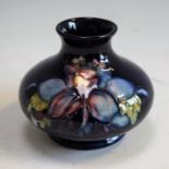 Ceramics - a Moorcroft orchid vase, blue ground, paper label, approx 7.