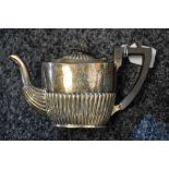 A late 19th century Chester silver bachelors teapot, graduated body, ebony handle,