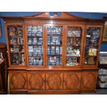 A substantial contemporary breakcentre library bookcase, in the George III taste, 267.