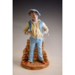 A German bisque figure, possibly Gebruder Heubach, of a young boy, standing whistling, 36cm high, c.
