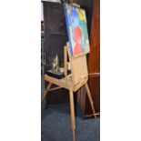 An artist's travelling easel, paints, paper, palette,