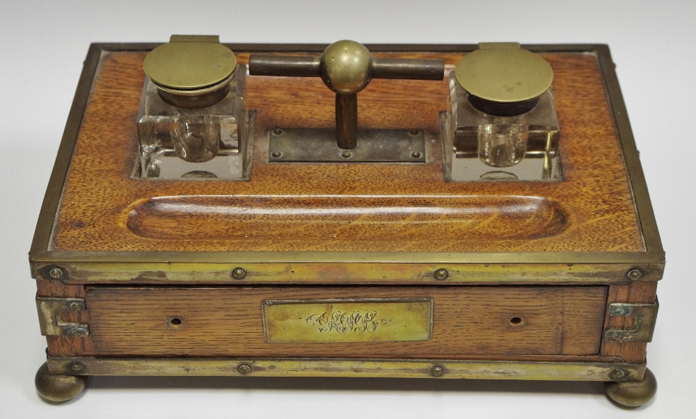 A Victorian oak desk stand with monogrammed cartouche, bun feet c.