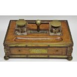 A Victorian oak desk stand with monogrammed cartouche, bun feet c.