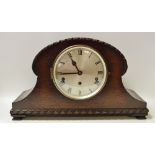 An oak mantel clock