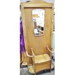 A 1930's/40's oak hall stand, shaped mirror,