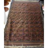 A hand woven Middle Eastern rug decorated geometric designs. 170cm x 102cm.