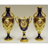 A Coalport three handled pedestal ovoid vase, painted with an oval cartouche,