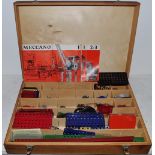 Various Meccano contained in a fitted wooden box with instructions for sets 1,