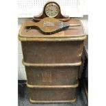 An early 20th century trunk; a pair of fire bellows; a mantel clock.