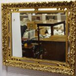 Interior Design - a decorative gilt frame embossed in relief with scrolling foliage