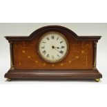 An Edwardian mahogany mantel clock, French movement, architectural pediment, enamel face,