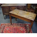 A 17th century style oak sideboard, 137cm wide; an oak centre/serving table, tapered square legs,
