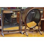 A Edwardian mahogany oval dressing mirror; another, rectangular mirror.