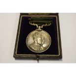 An Edward VII commemorative medal awarded to the employees of Vickers Sons & Maxim Limited for 30