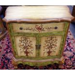 A modern French style painted serpentine side cabinet, oversailing moulded top,