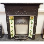 A reproduction Art Nouveau style cast iron fire surround with ceramic tiles