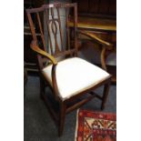 A George III ash and elm armchair, fleur de lys pierced and shaped splat,