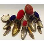 A large white metal pin cushion in the form of shoe; others in varying sizes etc.