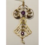 A 9ct gold pendant set with amethyst and seed pearls. 3.