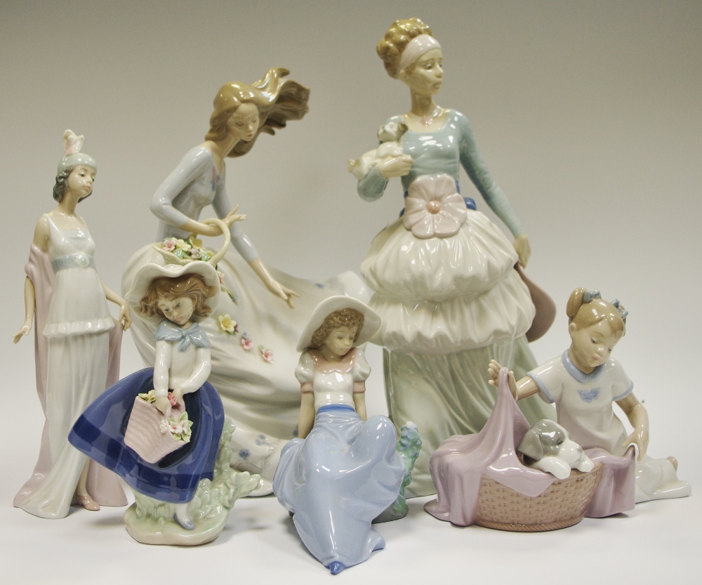 A Lladro figure, Girl with basket of flowers, 6767, boxed; another, smaller,