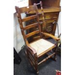An unusual 19th century ash and elm rocking chair with handles to flanks, ladder back splats,