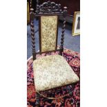 A 19th century hall chair,pierced and shaped pediment, barley twist uprights, padded back and seat,