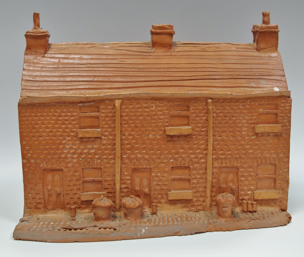 Studio pottery - a terracotta row of terraced houses.