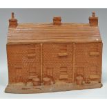 Studio pottery - a terracotta row of terraced houses.
