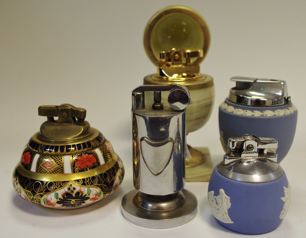 A Royal Crown Derby 1128 Imari table lighter; a Wedgwood Jasperware table lighter; another similar;