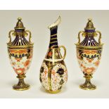 A pair of Royal Crown Derby Imari palette 5590 pattern two handled pedestal vases and covers, 17.