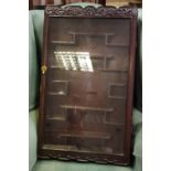 An oriental wall mounted single door display cabinet fitted with stepped shaped shelves.