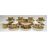 A set of twelve Royal Crown Derby 2451 tea cups and saucers, early 20th century,