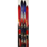 Two pairs of skis with poles